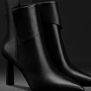 Sleek Black Leather Heeled Boots